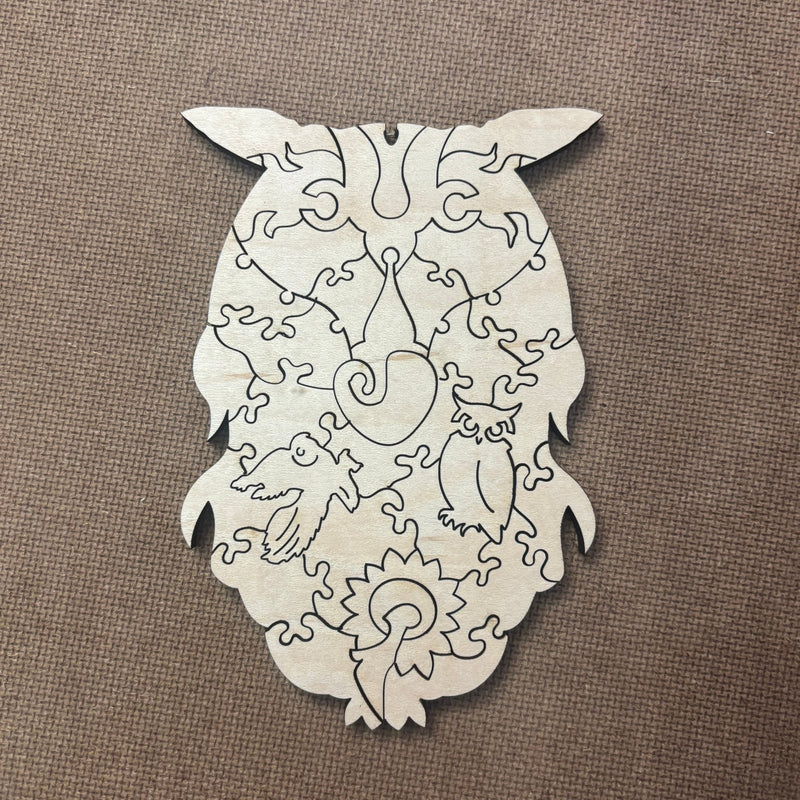 detail of the owl in the Wooden Owl Jigsaw Puzzle - The Chronicles of Boulder - Liminal Puzzle Co